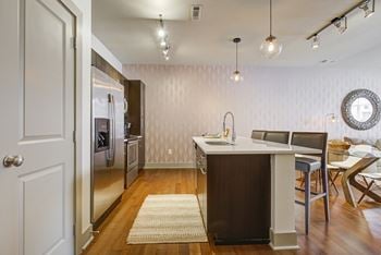 Gourmet kitchens with stainless steel appliances and granite counters/backsplashes